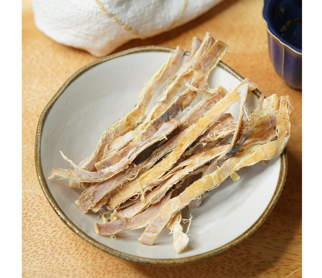 Image showing the INOUE FOODS Fried Squid snack outside its packaging, displaying the crispy fried squid pieces clearly.