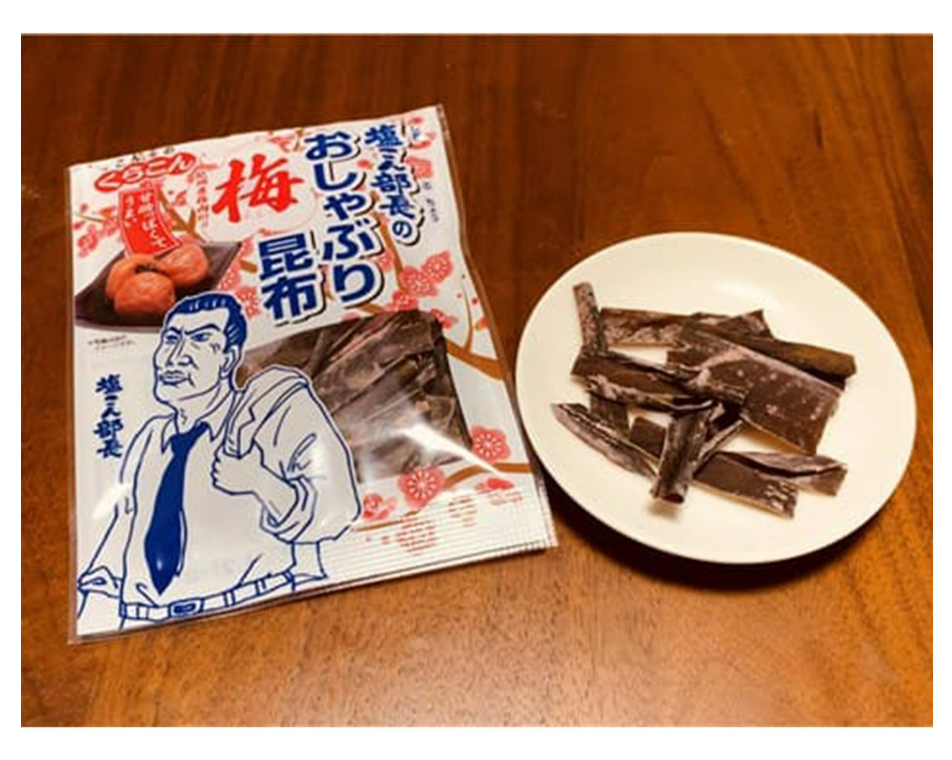 Image showing the JAPAN OTHERS Kishu Ume Sour Sweet Chew with Kelp candies outside their packaging, clearly displaying the chewy texture.
