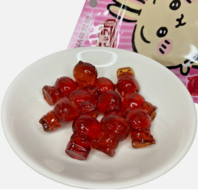 Image showing the UHA Chiiikawa Soft & Chewy Character Gummies outside the packaging, displaying the cute character-shaped gummy pieces clearly.