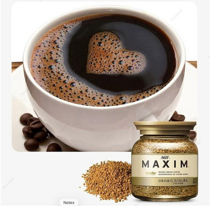 Image showing the AGF Maxim Gold Instant Coffee bottle placed beside a prepared cup of coffee, with the product jar closed and the brewed coffee clearly displayed, all set against a clean white background.
