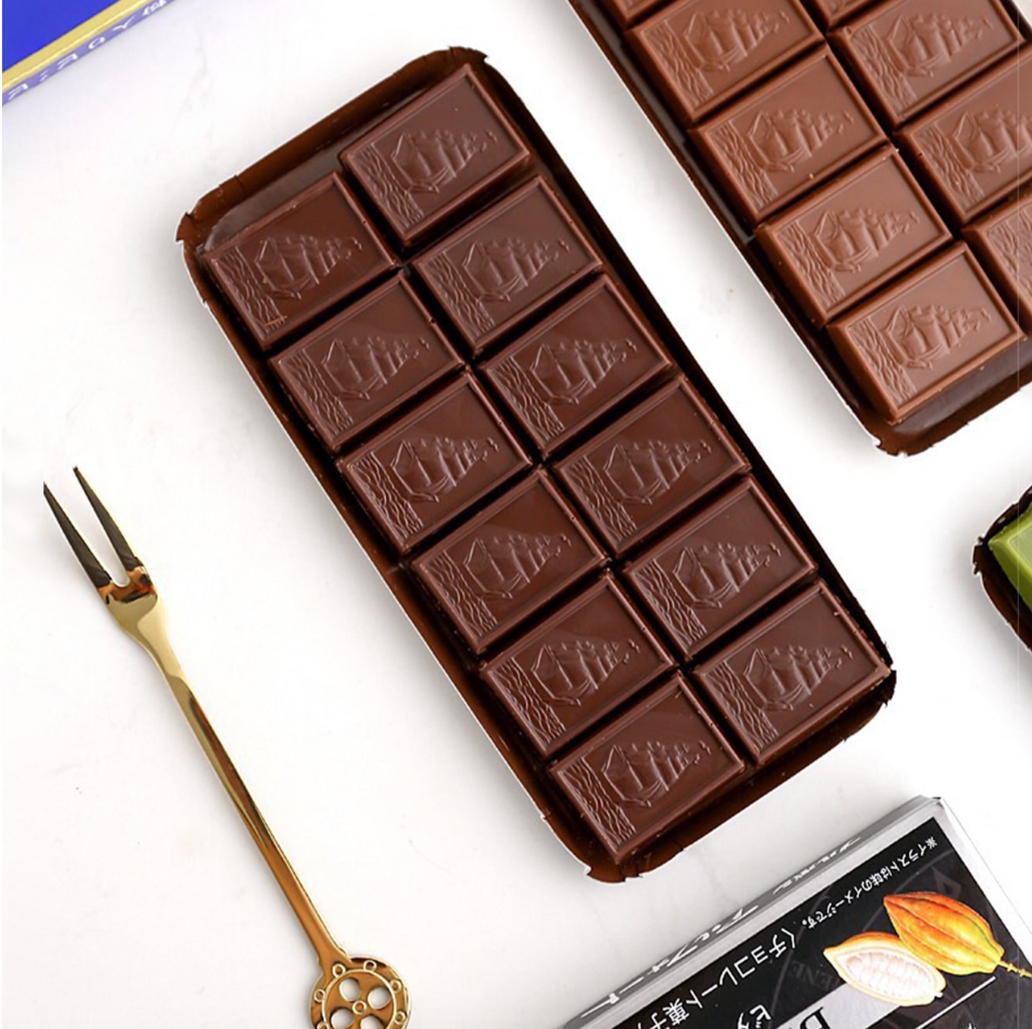 A close-up image emphasizing the shape and detailing of the BOURBON Alfort Mini Chocolate Biscuits 12pcs, highlighting the chocolate design and biscuit texture.