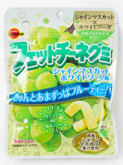 Front-facing image of BOURBON fettuccine-style gummy candy in Shine Muscat grape flavor, showing a closed 47 g pouch with vibrant green grape graphics on a white background.
