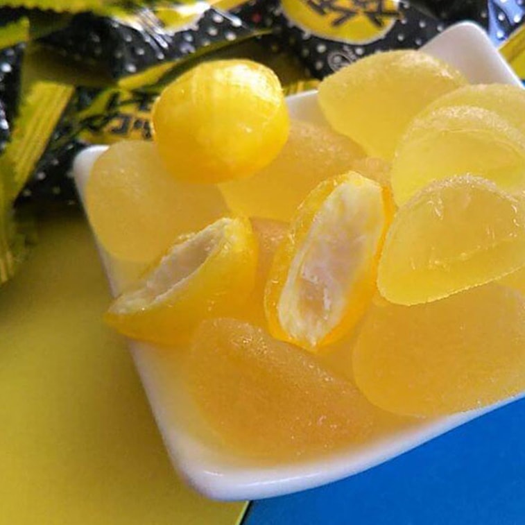 The FUJIYA Lemon Candy 72g displayed outside its packaging, showing the individual lemon-flavored hard candies and their appearance.