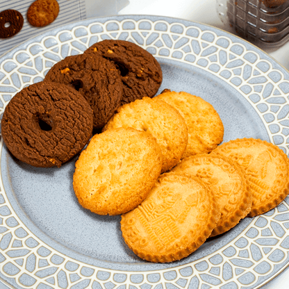 Assorted ITO Seika cookies arranged on a plate, displaying the coconut, sable, and chocolate almond varieties in a clean product presentation.