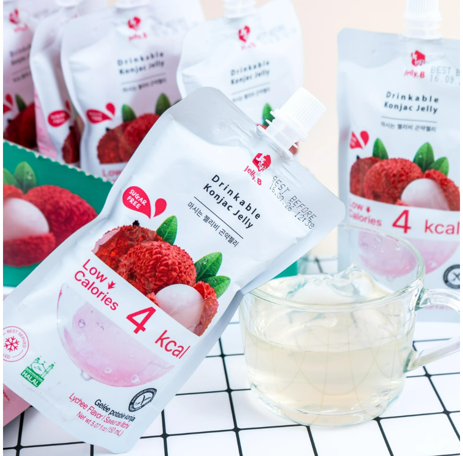 Image showing the JELLY.B Lychee Konjac Jelly pouches outside the box, with individual sugar-free lychee jelly packs displayed to show their design and packaging.
