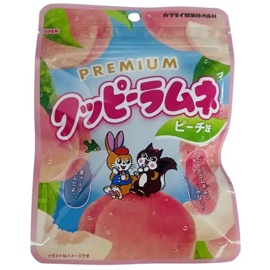 A front-facing portrait view of the KAKUDAI Premium Ramune Candy Peach 30g bag, shown sealed against a clean white background.