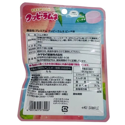 The back of the KAKUDAI Premium Ramune Candy Peach 30g bag in portrait orientation, summarizing the product details and packaging information on a white background.
