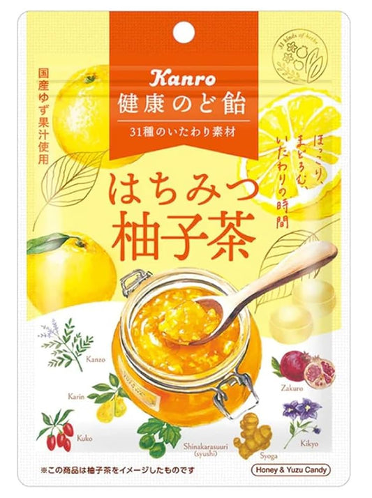 A front-facing image of the closed Kanro Healthy Throat Lozenge Honey Yuzu Tea 80g bag in portrait orientation on a white background, showing the honey and yuzu-themed throat candy packaging.