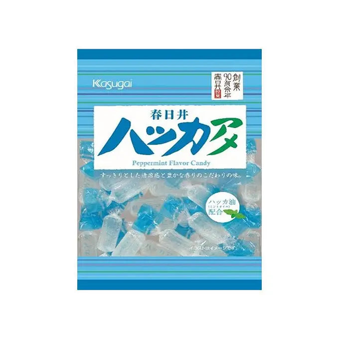 Front-facing sealed blue bag of Kasugai Hakka Ame Peppermint Candy with individually wrapped mints visible through the packaging, photographed against a white background.