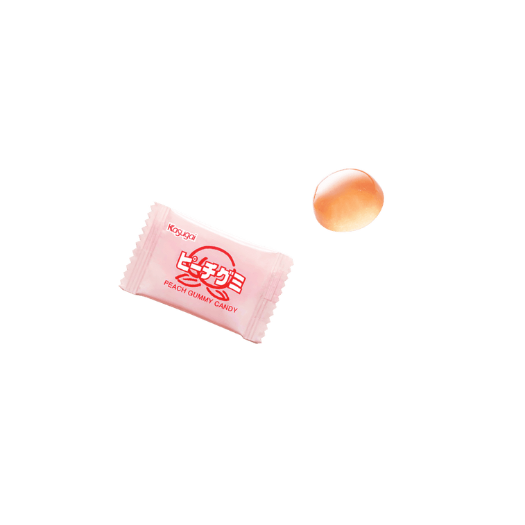 KASUGAI Peach Gummy Candy displayed on a white plate with individual gummies showing their soft, chewy texture outside the packaging.