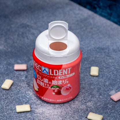 Image of the Mondelez Recaldent Apple & Peach Flavor Gum with the packaging open, showing the gum pieces inside.