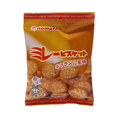 Front-facing view of the Nomura Millet Biscuits Caramel 70g bag, shown upright with full graphics visible on a clean white background.