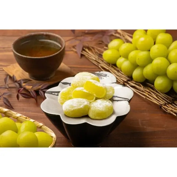 Portrait photo of SEIKI Shine Muscat Grape Daifuku served in a differently colored bowl, highlighting the chewy mochi exterior and grape flavor presentation.