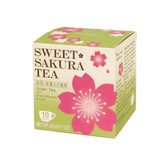 Angled front-facing image of the TEA BOUTIQUE Sweet Sakura Tea Green Tea box, shown closed in a square format with the full front design, sakura graphics, and text clearly visible against a white background.