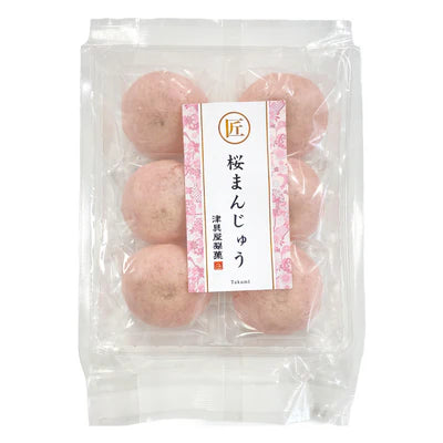 Front-facing view of the TSUGUYA SEIKA Sakura Manju package, sealed and shown upright in a portrait orientation against a white background.