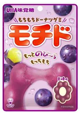 Front-facing image of UHA Mikakuto Mochido doughnut-shaped gummy candy in grape flavor, showing a closed 45 g pouch with playful Japanese graphics displayed flat on a white background.