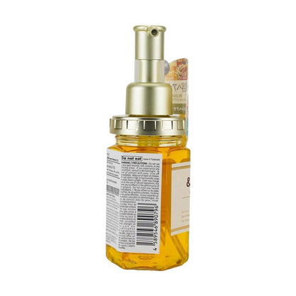 A left-side portrait image of the closed pump bottle of VICREA &honey Deep Moist Hair Oil 3.0 on a white background, highlighting the bottle’s design and details.